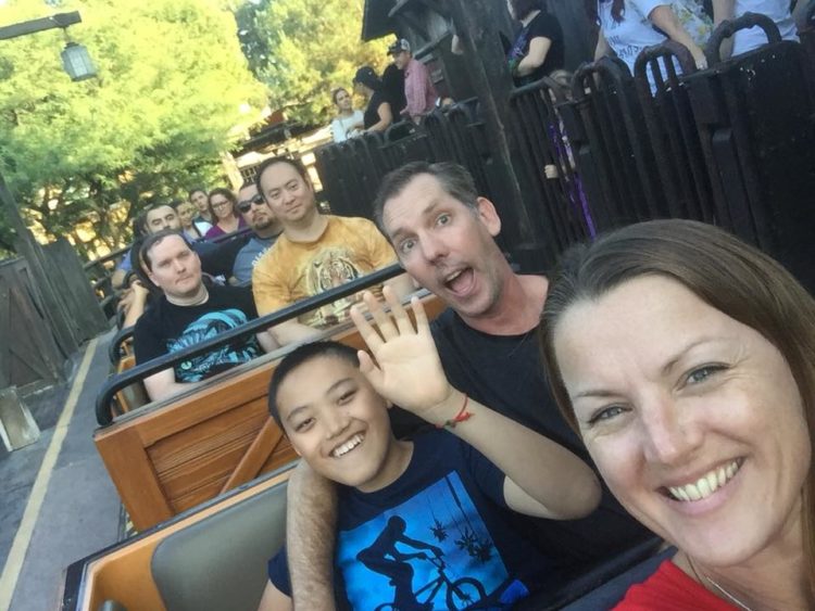 Family ridding a roller coaster