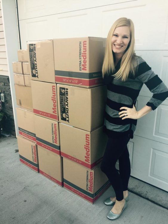 christensen standing with boxes