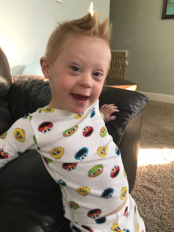 Little boy wearing "sesame Street" pajamas