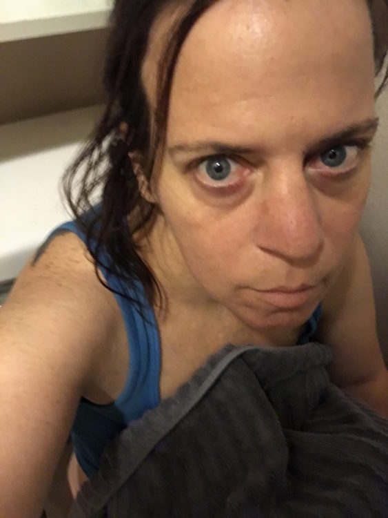 woman sitting on the toilet feeling sick