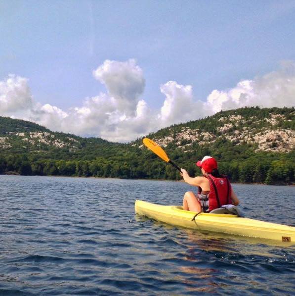 The writer kayaking.