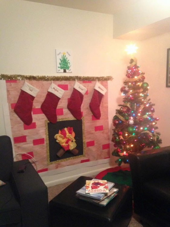 a person's living room decorated with Christmas decorations