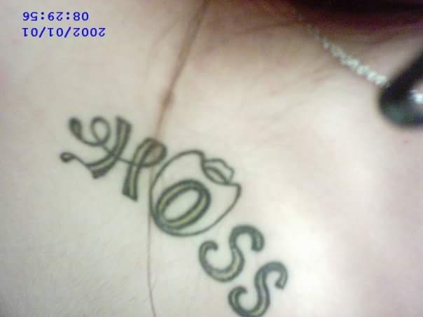 woman with the word "Hoss" tattooed on her arm