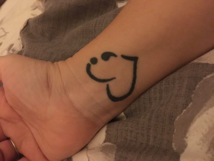 tattoo of a heart and semicolon