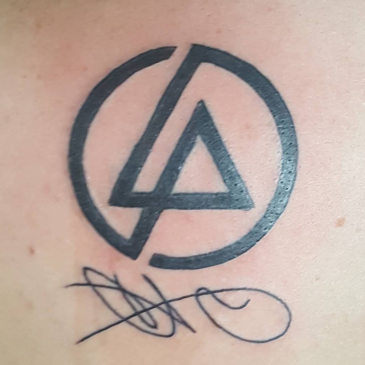 tattoo of chester bennington's signature and the Linkin Park logo