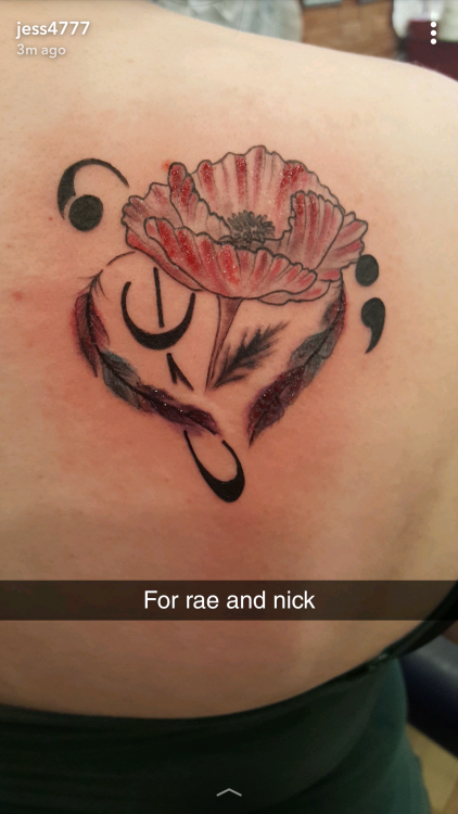 tattoo of music notes and a poppy flower