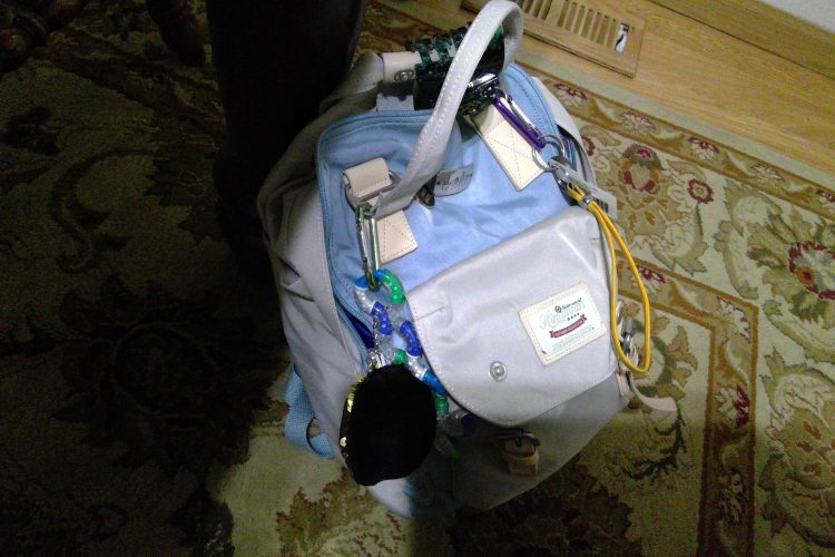 woman's backpack filled with essentials for managing dysautonomia