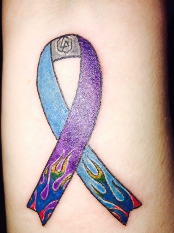 Tattoo of purple and blue ribbon