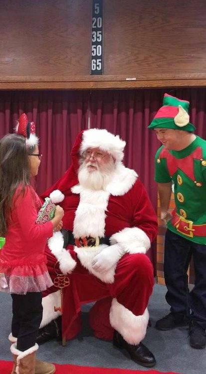 Sean McElwee dressed as an Elf being Santa's helper