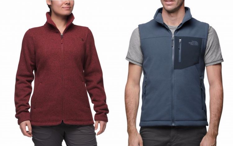 north face red women's jacket and blue men's vest