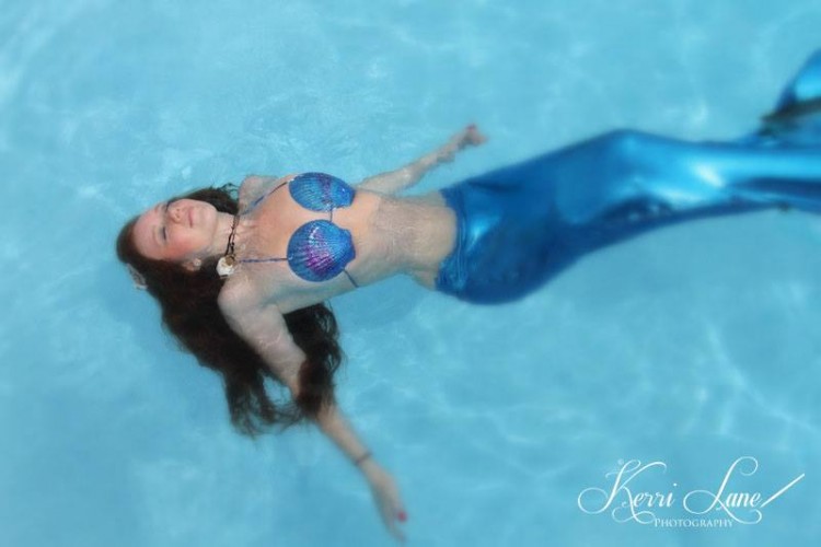 woman with red hair photographed as a mermaid