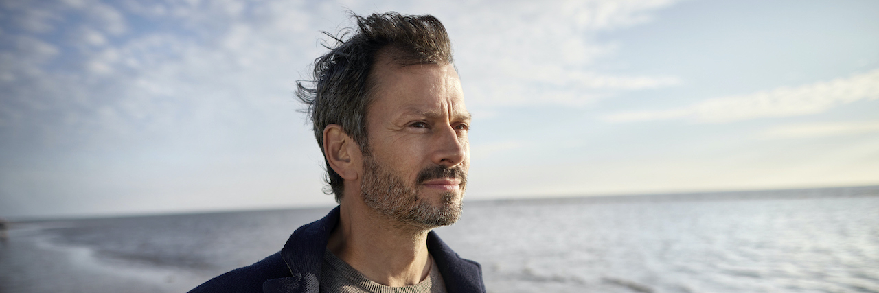 A Life With Multiple Sclerosis Is Not a Death Sentence: 6 Myths About MS Man on beach looking at view