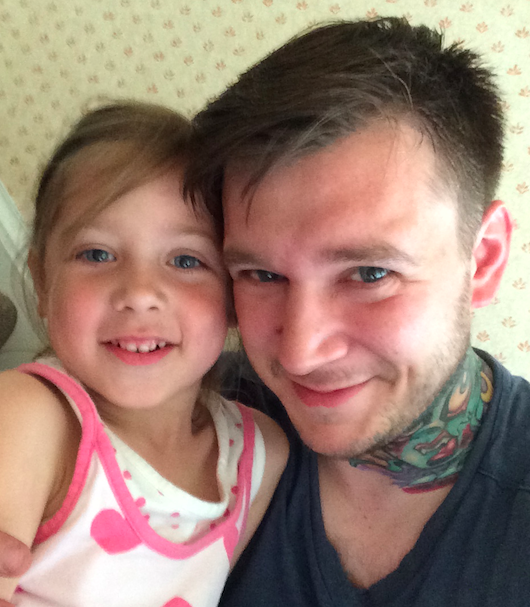 Tattoo artist Jeff Paetzold with his daughter