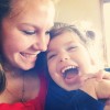 woman and little girl with autism smiling