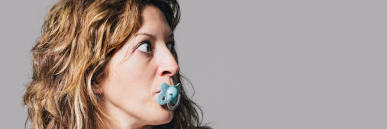 young woman with a pacifier