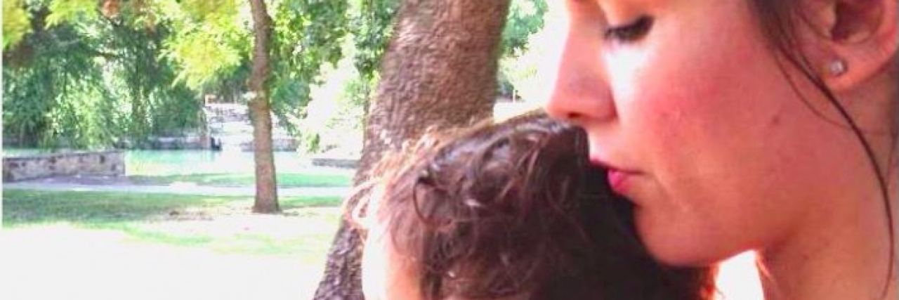 To the Paramedic Who Said the Right Thing When My Son Had a Seizure Mother holding young son outside