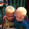 young boy putting his arm around his cousin