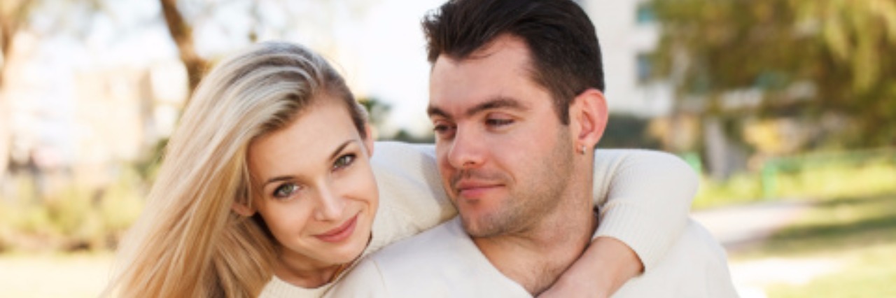 Dating Someone With a Disability Doesn't Have to Be Awkward blonde woman and boyfriend embracing each other