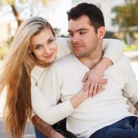 blonde woman and boyfriend embracing each other