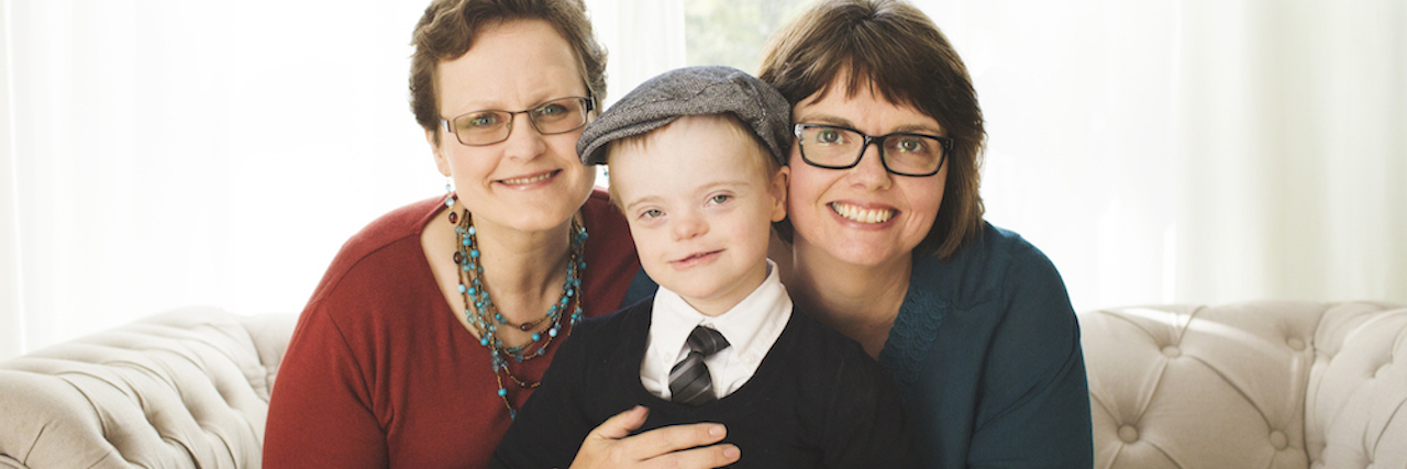 Boy With Down Syndrome Meets Grown Up with Down Syndrome Two women and their son with Down syndrome