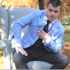spain's first male model sitting outside in a blue jacket