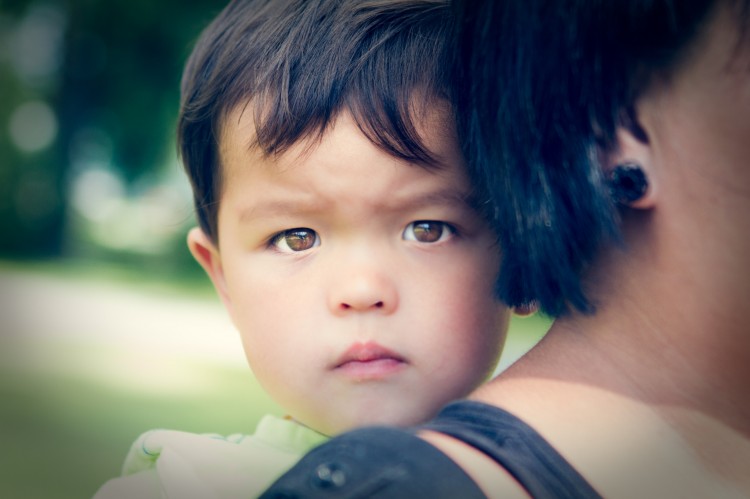 young boy on mother's back