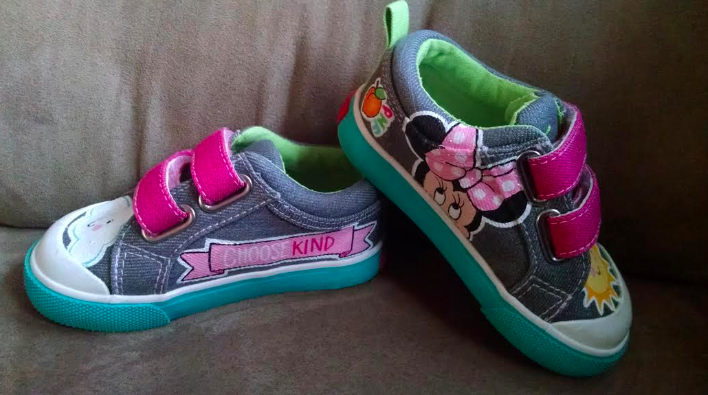 shoes given to Beth's daughter from Peach's Neet Feet. one shoe has a picture of minnie mouse and the other shoe has a pink banner that says 'choose kind'