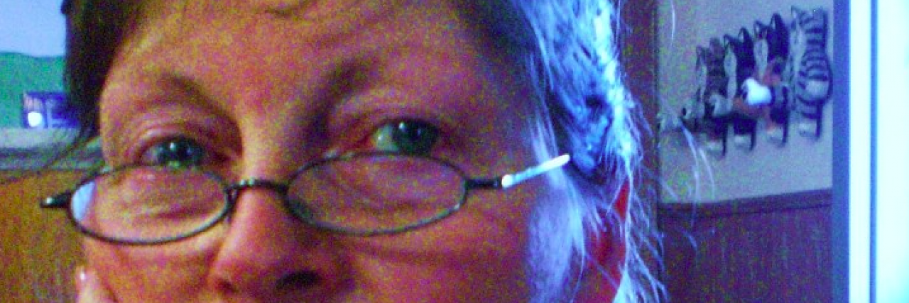 My Thank You Letter to Cancer Contributor wearing glasses and with hand on her chin