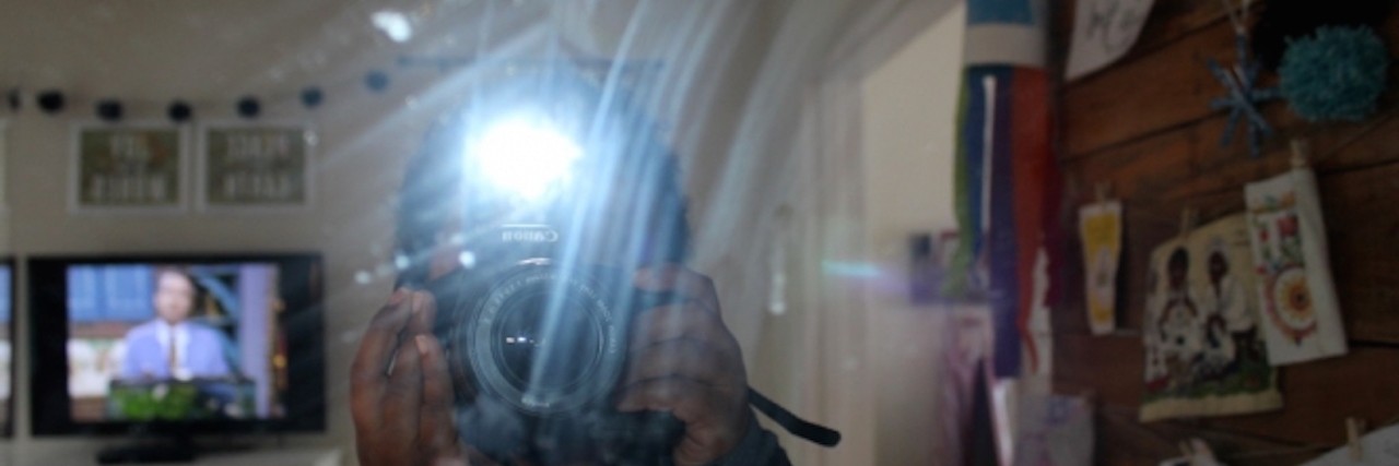 Photos Boy With Autism Took That Show How He Sees the World boy with autism taking a picture into a mirror