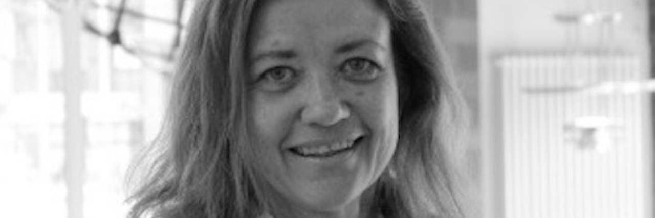 McCune-Albright Syndrome: A Letter to My Rare Disease I Want to Expose an upclose, profile photo of a smiling woman