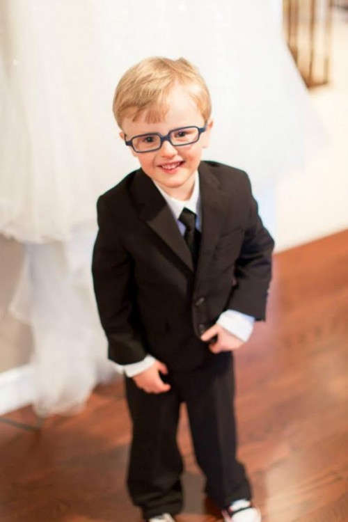 young boy wearing suit and tie