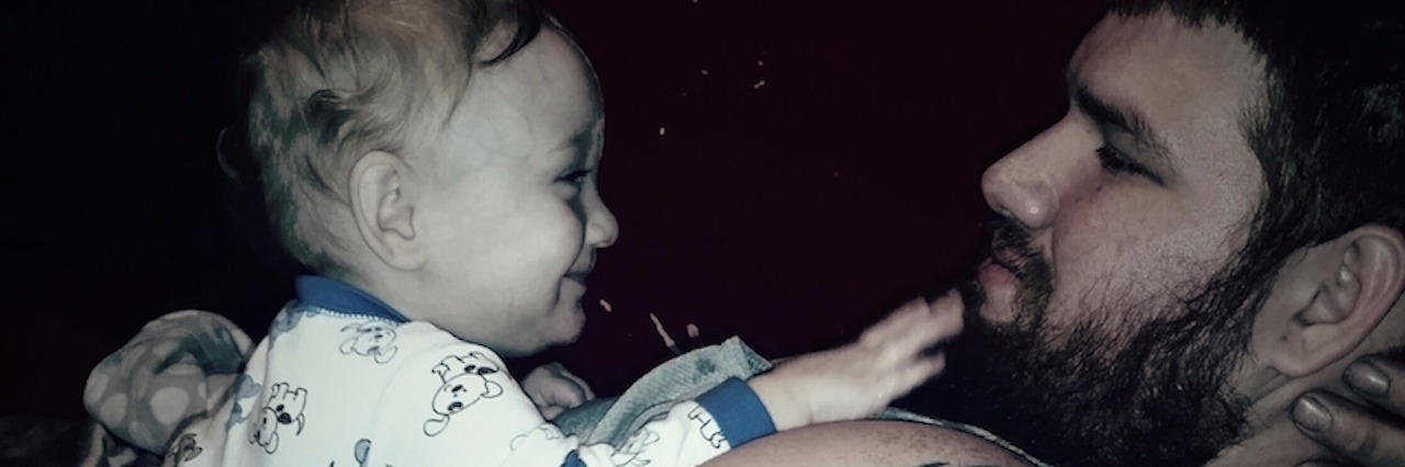 Stranger Compliments Man's Parenting of Son With Special Needs author's husband holds their son