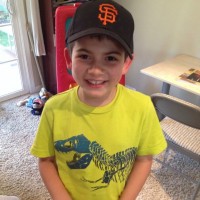 young boy wearing a San Francisco Giants cap