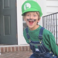 Boy wearing Luigi costume