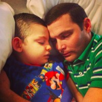 dad and son sleeping next to each other