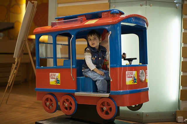 little boy in mall train