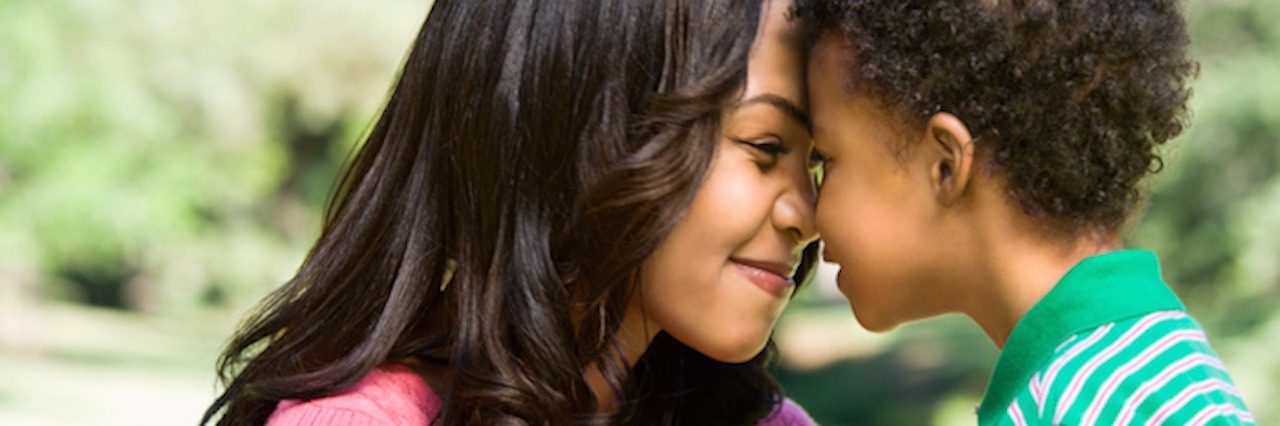 Words of Encouragement for Special Needs Moms mother and young son with heads together smiling