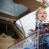 Mother Pushing Son in Shopping Cart