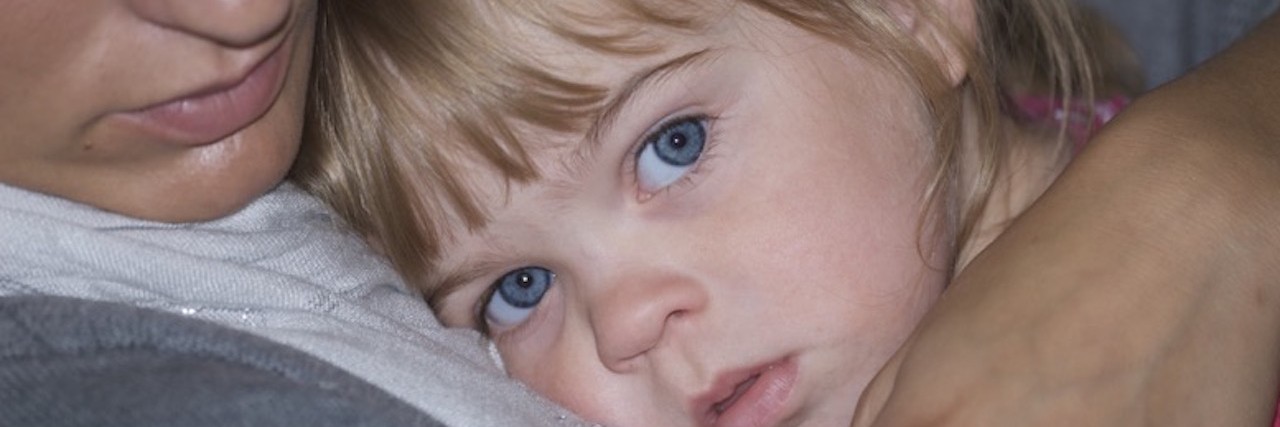 Autism Researcher, Father Founds Superplus for Special Needs Families parent holding young daughter