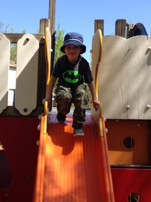 boy on slide at playground