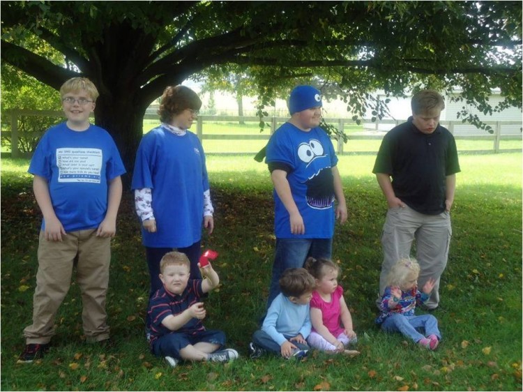 older brothers and young kids at the park