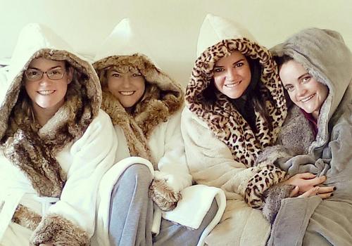 four women in warm jackets