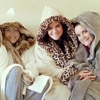 four women in heavy coats