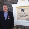 mayor gavin harding stands in front of town council building