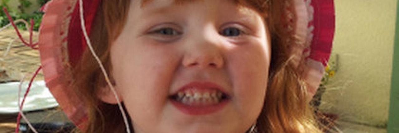 Man Who Lost Child to Batten Disease Describes Her as a Superhero girl wearing hat
