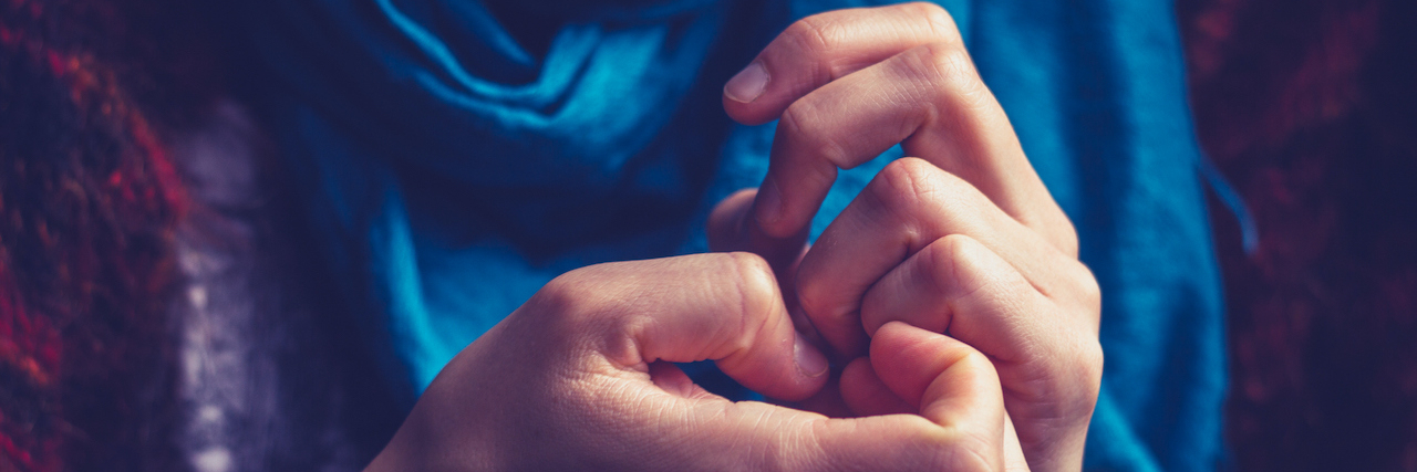 Important Things to Know About Anxiety and Panic Attacks Close up of a person's hands as they are picking their nails