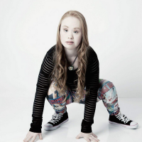 Madeline Stuart crouched over with her hands on the floor