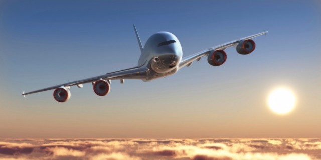 plane flying above clouds