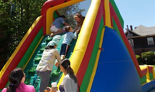 children playing on inflatable slide