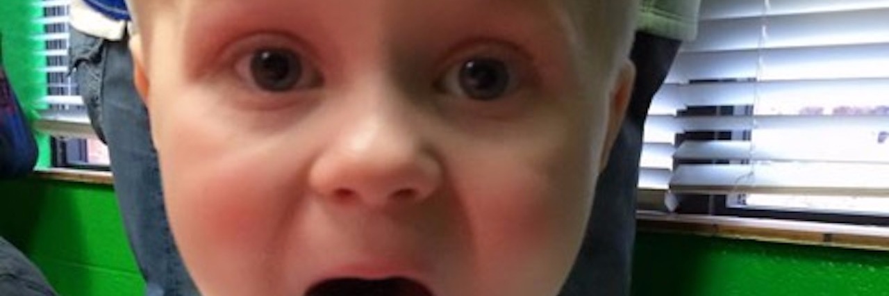 The Difficulty of Talking About Childhood Cancer and Death Kristy's son eating cake